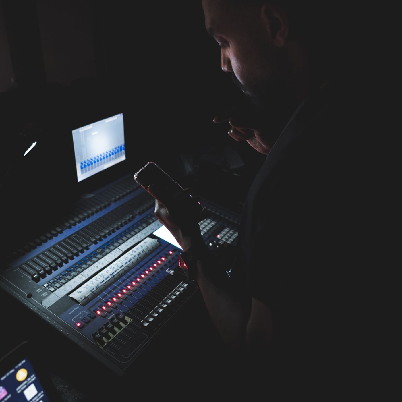 Two people recording a professional podcast in a quiet studio with boom arm microphones